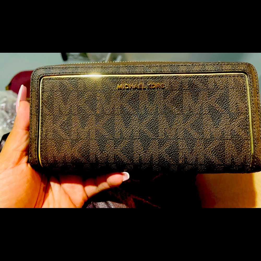 Brown and tan MK signature bifold.
